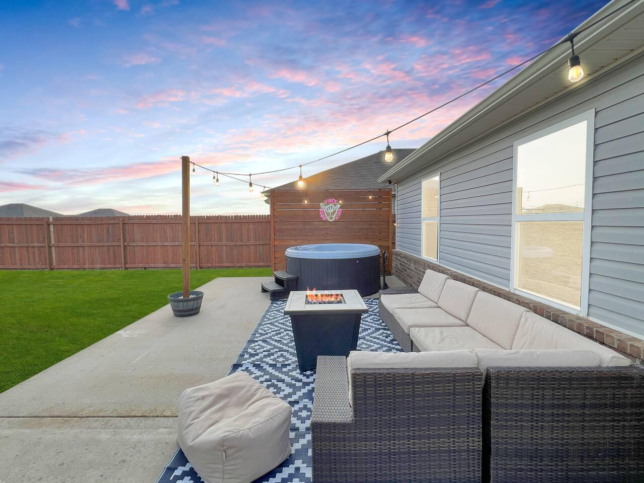 Back patio - Large outdoor space with Classic Nordic Spa that seats up to 6 adults.
Stainless steel propane grill for grilling.
Fire pit table and outdoor sectional.